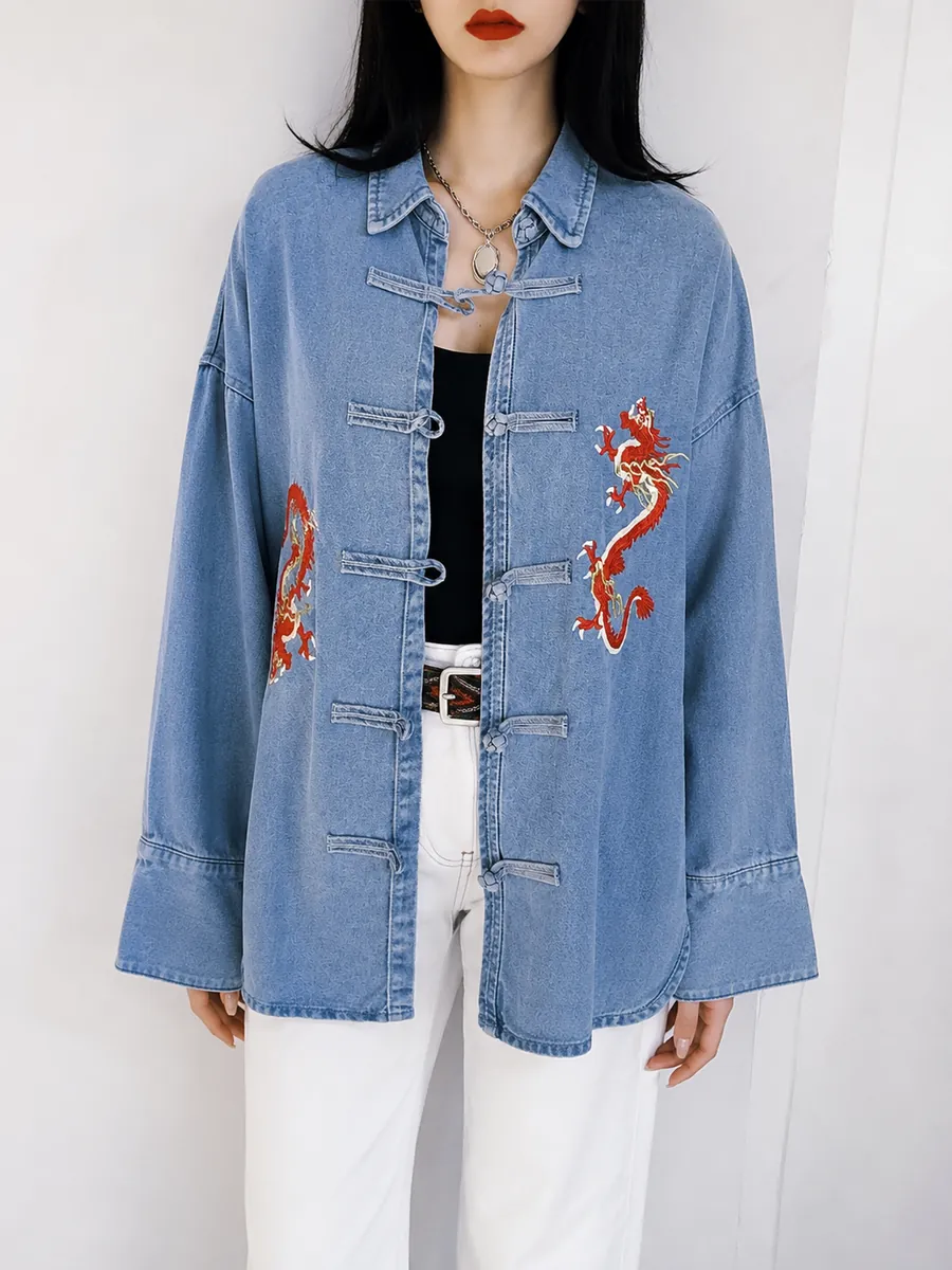 Pale denim frog-button jacket with red dragon embroidery, white trousers