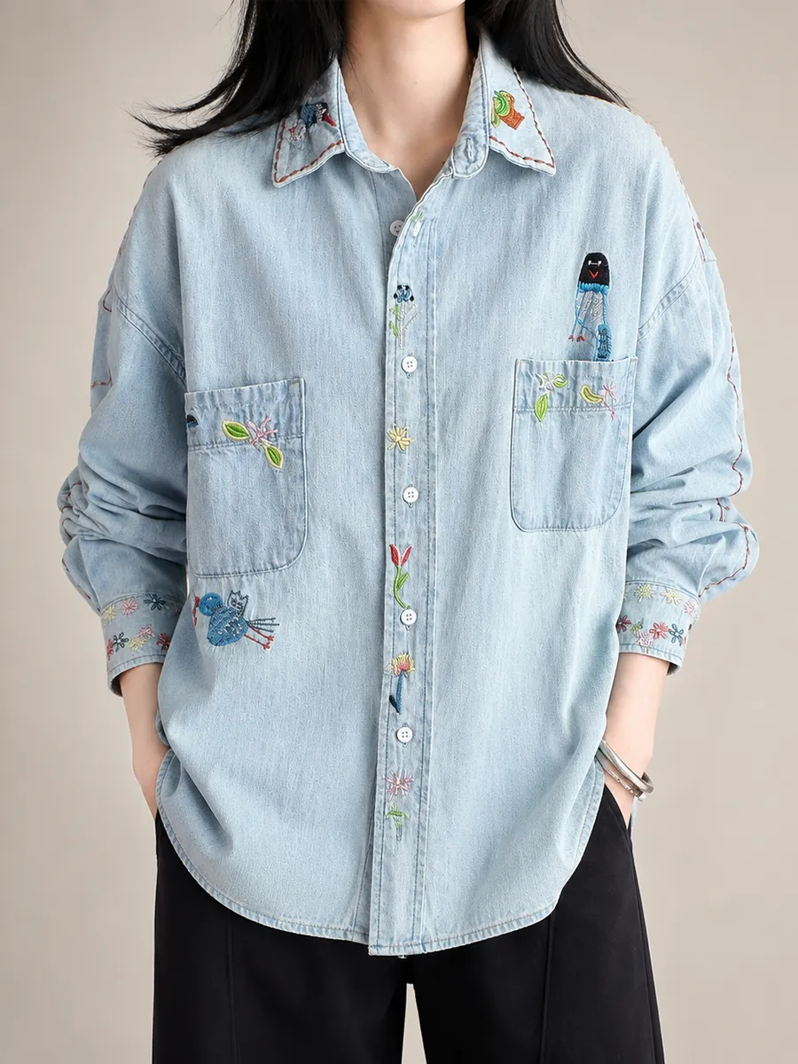 Pale striped denim shirt with small embroidered motifs