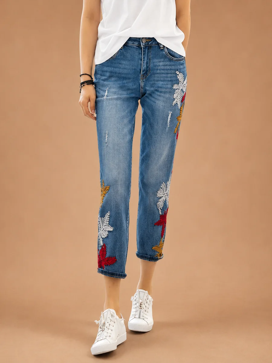 Cropped straight jeans with embroidered flowers down the leg