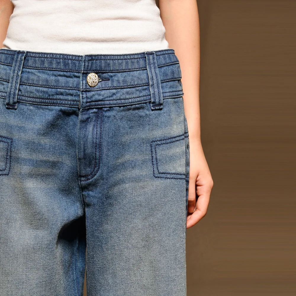 Front waistband and pocket detail of straight jeans