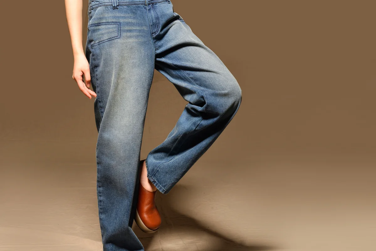 Straight leg in motion, showing the soft fade of the wash